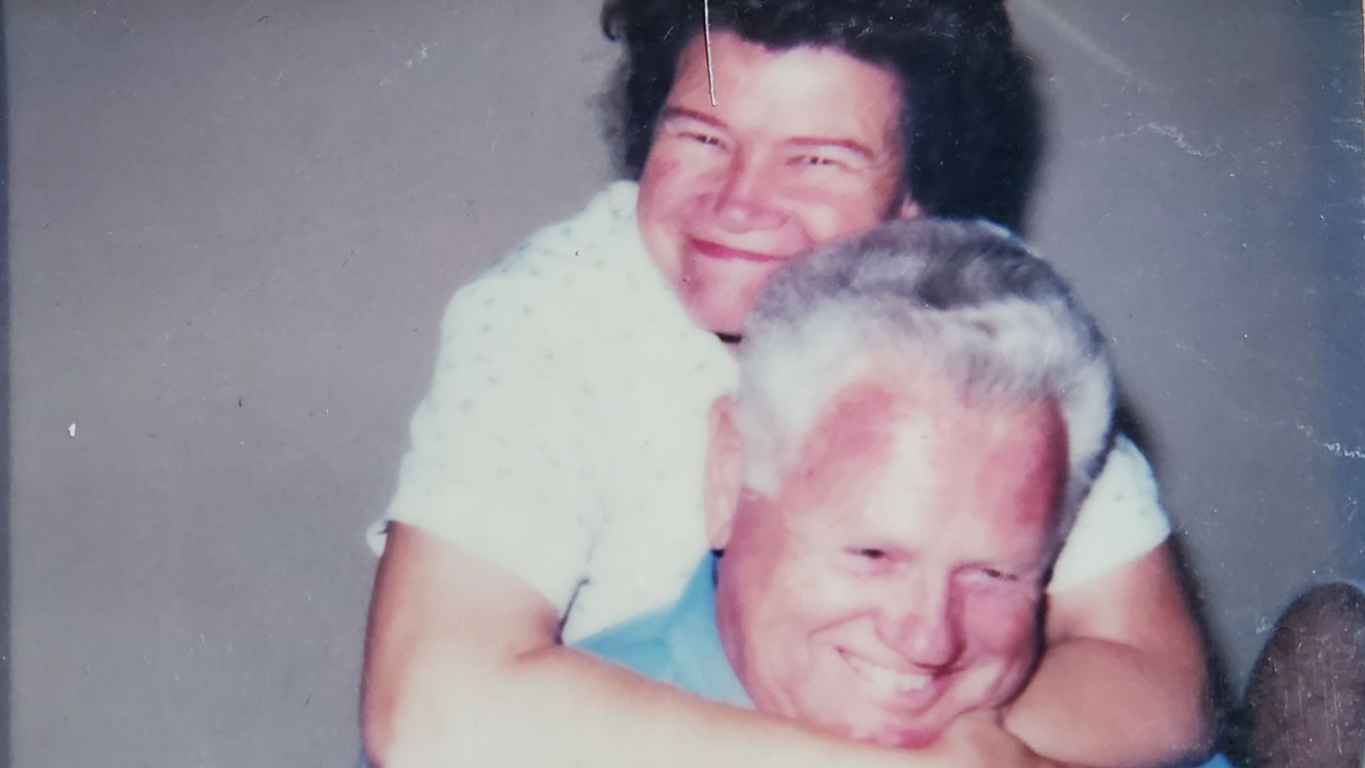 mom and dad husband and wife hugging