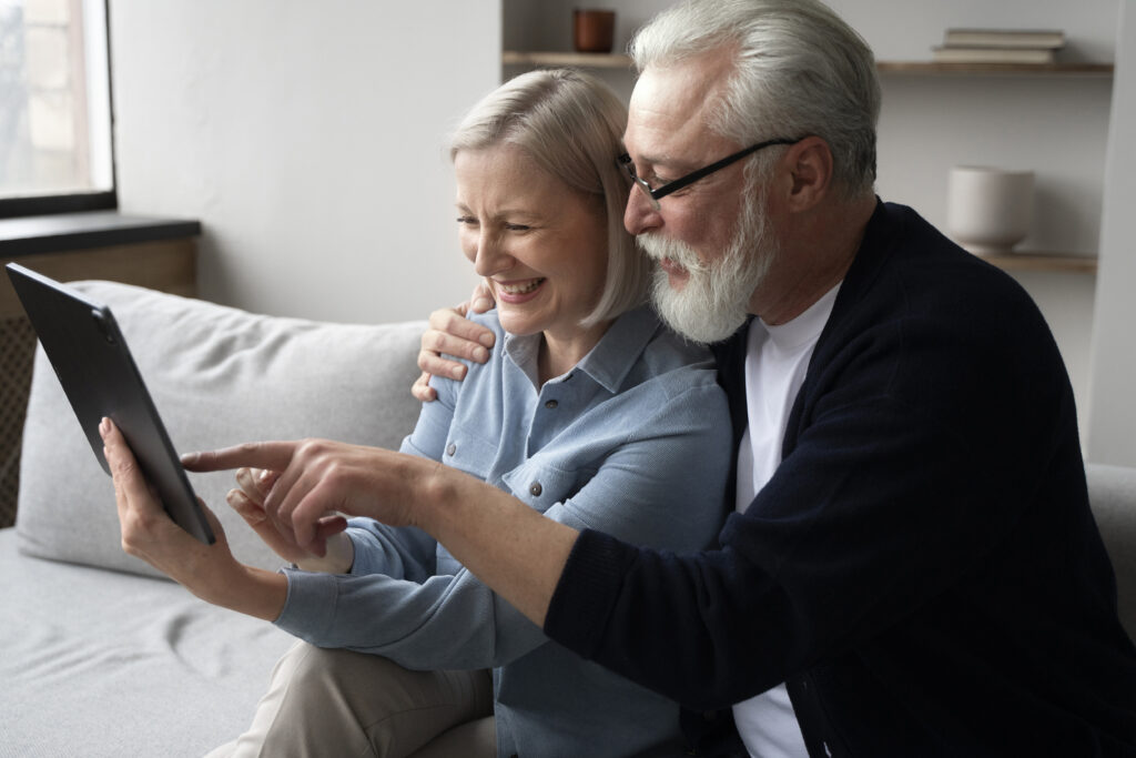 Senior using digital memory book on tablet for dementia support