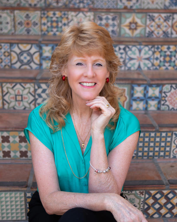 parents and daughter smiling